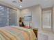Bedroom boasts a window with privacy shades and a comfortable bed setting at 12249 Catanzaro Ave, Las Vegas, NV 89138