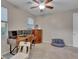 Bedroom featuring desk setup, ceiling fan, and beanbag chair at 12249 Catanzaro Ave, Las Vegas, NV 89138