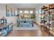 Dining room with chandelier, blue rug, and natural light at 12249 Catanzaro Ave, Las Vegas, NV 89138