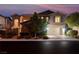 Two-story home with neutral color, landscaped front yard, two-car garage, and inviting curb appeal at 12249 Catanzaro Ave, Las Vegas, NV 89138