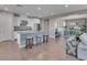 Well-lit kitchen with white cabinets, stainless steel appliances, and a granite island with seating at 12249 Catanzaro Ave, Las Vegas, NV 89138