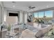 Bright living room with mountain views, comfortable seating, and access to the outdoors at 12249 Catanzaro Ave, Las Vegas, NV 89138