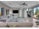 Bright living room with mountain views, comfortable seating, and access to the outdoors at 12249 Catanzaro Ave, Las Vegas, NV 89138