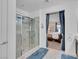 Elegant walk-in shower in main bathroom with a view of the bedroom at 12249 Catanzaro Ave, Las Vegas, NV 89138