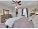 Spacious bedroom with ceiling fan, carpet, and ensuite bathroom at 12249 Catanzaro Ave, Las Vegas, NV 89138