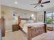 Main bedroom with wood furniture, ceiling fan, carpet, and view of the mountains at 12249 Catanzaro Ave, Las Vegas, NV 89138