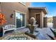 Charming courtyard featuring a decorative fountain and outdoor seating at 12249 Catanzaro Ave, Las Vegas, NV 89138