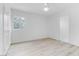Bright, empty bedroom with fresh light and hardwood flooring, ready for personal touch at 1225 S 15Th St, Las Vegas, NV 89104