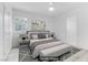 Staged bedroom featuring a comfortable bed, stylish decor, and serene ambiance at 1225 S 15Th St, Las Vegas, NV 89104