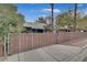 Front exterior with gated entrance and drought-tolerant landscaping, providing both security and curb appeal at 1225 S 15Th St, Las Vegas, NV 89104