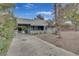 Charming home with covered parking featuring drought tolerant landscaping and mature trees at 1225 S 15Th St, Las Vegas, NV 89104