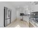 Modern kitchen featuring white cabinets, stainless steel appliances, and hardwood floors at 1225 S 15Th St, Las Vegas, NV 89104