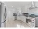 Modern kitchen featuring white cabinets, stainless steel appliances, and updated countertops at 1225 S 15Th St, Las Vegas, NV 89104