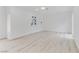 Clean and bright living room with hardwood floors, fresh paint, and a ceiling fan at 1225 S 15Th St, Las Vegas, NV 89104