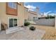 Backyard featuring brick patio, a fire pit and direct access to the house at 1660 Cloister Ave, Henderson, NV 89014