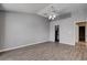 Spacious primary bedroom featuring wood-look floors, ceiling fan, and neutral paint palette at 1660 Cloister Ave, Henderson, NV 89014