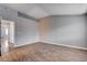 Bedroom with neutral walls, modern vinyl flooring, and access to other rooms at 1660 Cloister Ave, Henderson, NV 89014