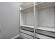 Spacious closet featuring adjustable shelving and wire basket drawers at 1660 Cloister Ave, Henderson, NV 89014