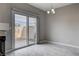 Bright dining area features tile flooring and a sliding glass door to the patio at 1660 Cloister Ave, Henderson, NV 89014