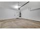 Spacious garage with a concrete floor, hot water tank and garage door opener at 1660 Cloister Ave, Henderson, NV 89014