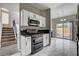 Open kitchen features stainless steel appliances and direct access to the backyard at 1660 Cloister Ave, Henderson, NV 89014