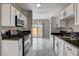 Charming kitchen view with backyard access, plenty of counter space and storage at 1660 Cloister Ave, Henderson, NV 89014