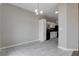 Open-concept kitchen with white cabinets and modern lighting fixture at 1660 Cloister Ave, Henderson, NV 89014