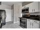 Kitchen features stainless steel appliances and ample cabinet space at 1660 Cloister Ave, Henderson, NV 89014