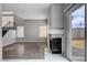 Cozy living room with fireplace and access to the outdoor patio at 1660 Cloister Ave, Henderson, NV 89014