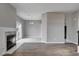 Open layout with fireplace, sliding doors, and tile flooring at 1660 Cloister Ave, Henderson, NV 89014