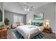 Serene main bedroom with a ceiling fan, sitting area, and ample natural light at 1660 Cloister Ave, Henderson, NV 89014