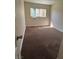 Bedroom featuring carpet flooring and natural light from the window at 1858 N Decatur Blvd # 204, Las Vegas, NV 89108