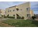 Tan two-story apartment building with a grassy lawn and shrubbery at 1858 N Decatur Blvd # 204, Las Vegas, NV 89108