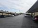 View of parking lot with covered parking and various cars parked at 1858 N Decatur Blvd # 204, Las Vegas, NV 89108