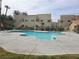 Community pool surrounded by well-maintained landscaping and apartment buildings at 1858 N Decatur Blvd # 204, Las Vegas, NV 89108