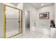 Bright bathroom features a glass enclosed shower and separate soaking tub at 2037 Summer Blossom Ct # 101, Las Vegas, NV 89134