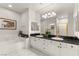 Spacious bathroom featuring a large vanity with dual sinks and a soaking tub at 2037 Summer Blossom Ct # 101, Las Vegas, NV 89134