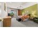 Bright bedroom boasts a ceiling fan, green accent wall, and patio access at 2037 Summer Blossom Ct # 101, Las Vegas, NV 89134