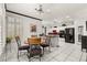 This eat-in kitchen features a breakfast nook, modern appliances and white cabinets at 2037 Summer Blossom Ct # 101, Las Vegas, NV 89134