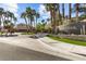 Gated community entrance with mature landscaping, community sign, and beautiful landscaping at 2037 Summer Blossom Ct # 101, Las Vegas, NV 89134