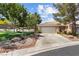 Charming single-story home features a well-maintained lawn, spacious driveway, and mature trees at 2037 Summer Blossom Ct # 101, Las Vegas, NV 89134