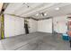 Spacious garage with ample storage cabinets and concrete flooring, offering plenty of space at 2037 Summer Blossom Ct # 101, Las Vegas, NV 89134