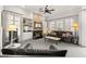 Bright living area features modern decor, a cozy fireplace, and large windows with plantation shutters at 2037 Summer Blossom Ct # 101, Las Vegas, NV 89134