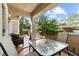 Relaxing outdoor patio features tiled flooring and covered seating at 2037 Summer Blossom Ct # 101, Las Vegas, NV 89134