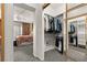 Organized walk-in closet with mirrored doors and ample storage at 2037 Summer Blossom Ct # 101, Las Vegas, NV 89134