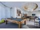 Inviting community lounge area featuring a pool table, ample seating, and stylish lighting fixtures at 222 Karen Ave # 2401, Las Vegas, NV 89109