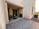 Paver patio with built-in fireplace and outdoor seating at 235 Desert Arroyo Ct, Henderson, NV 89012