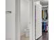 Cozy half bathroom with a toilet and a glimpse into a well-organized closet at 235 Desert Arroyo Ct, Henderson, NV 89012