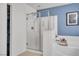 A bathroom featuring a glass-enclosed shower, soaking tub, and modern fixtures at 235 Desert Arroyo Ct, Henderson, NV 89012