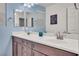 Elegant bathroom vanity with dual sinks, modern fixtures, and a serene blue accent wall at 235 Desert Arroyo Ct, Henderson, NV 89012
